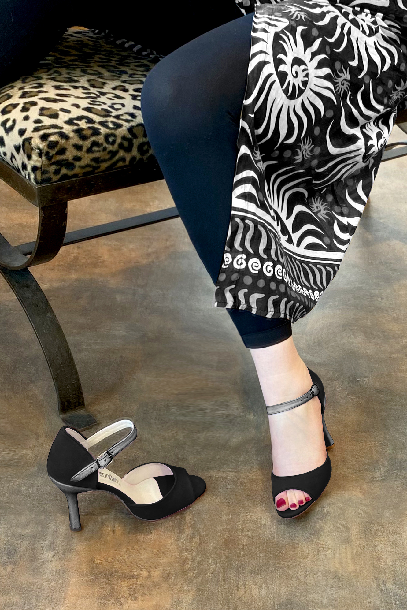 Matt black and dark silver women's closed back sandals, with an instep strap. Round toe. High spool heels. Worn view - Florence KOOIJMAN